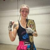 Fehn Foss Muay Thai CMTO Champion with Belt